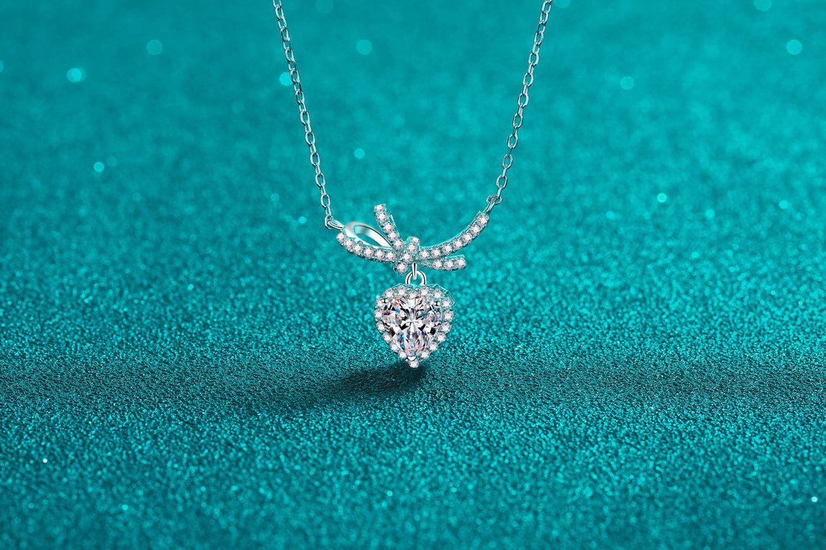 Bow and heart pendant necklace in sterling silver